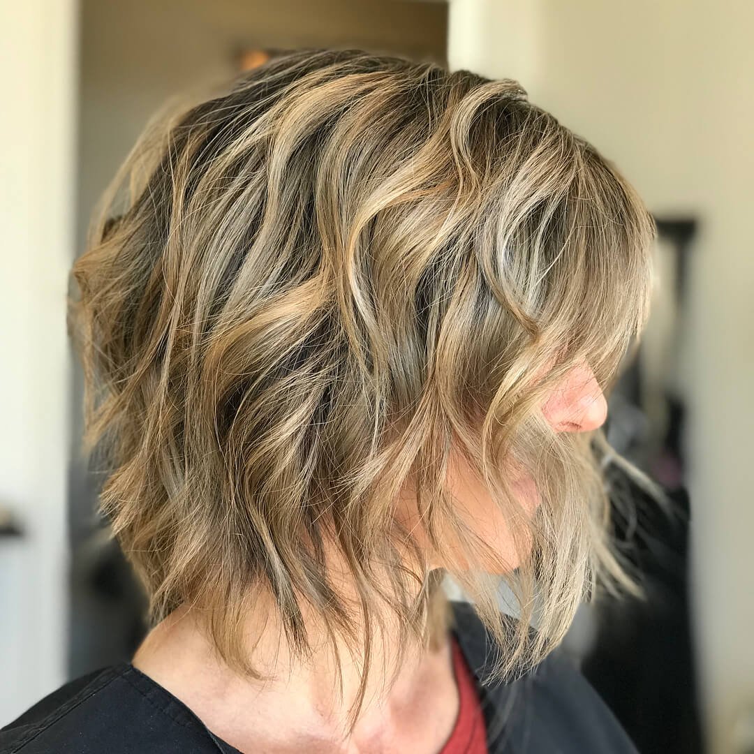 Trendy choppy bob with layers for texture, movement, and volume, creating a modern and carefree vibe