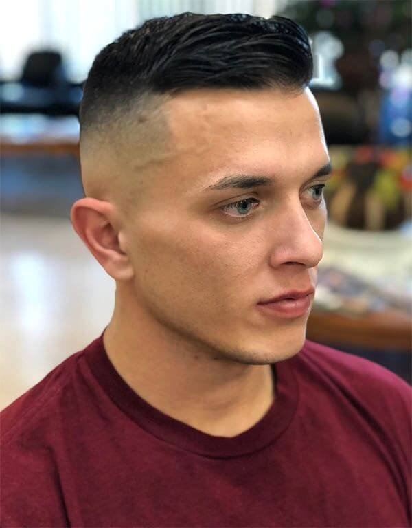 Military-inspired haircut with a short and neatly trimmed style, exuding a disciplined and sharp appearance