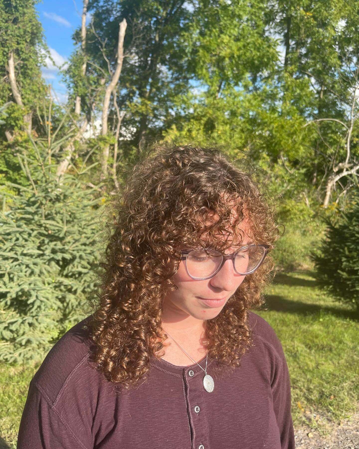 Curly Brown Wolf Cut With Micro Bangs
