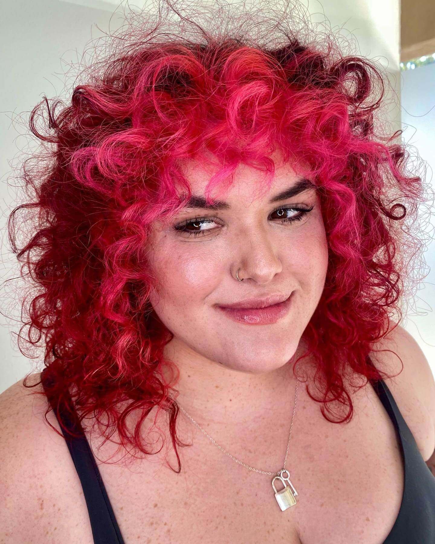 Curly Wolf Cut With Pink Highlights